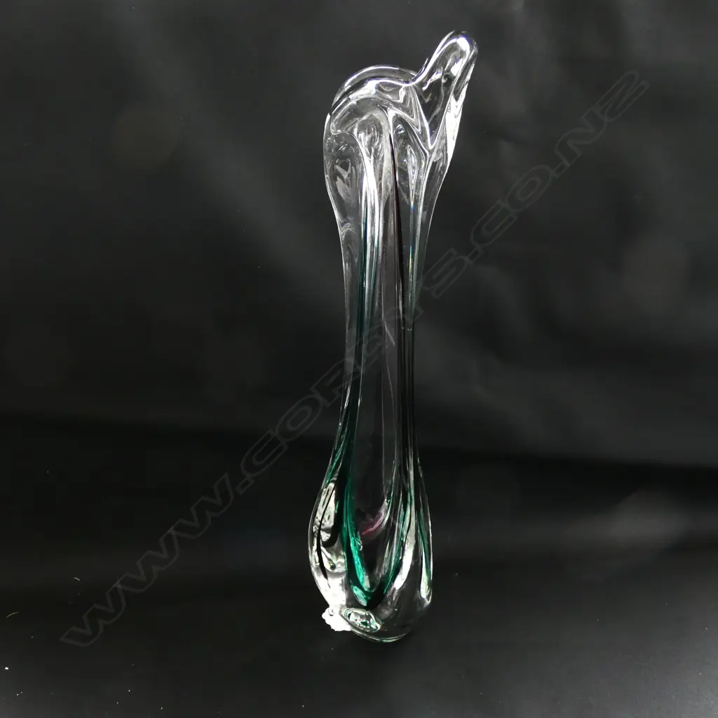 A tall slender glass vase Image 1++